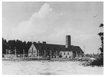 Black-and-white photograph of an building with a huge chimney