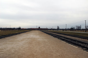 Rail trails in the left and the right, a building in the background