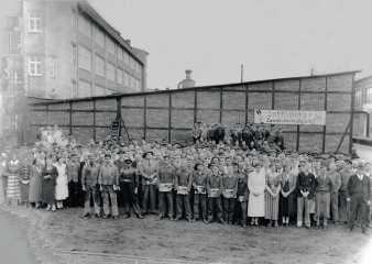 Staff in front of building